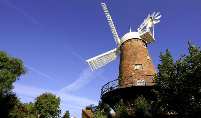 Photo of Green's Windmill with a blue sky in the background
